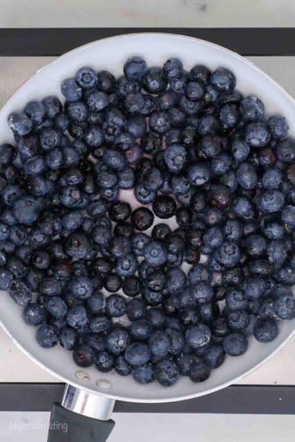 overhead shot of a saucepan filled with blueberries