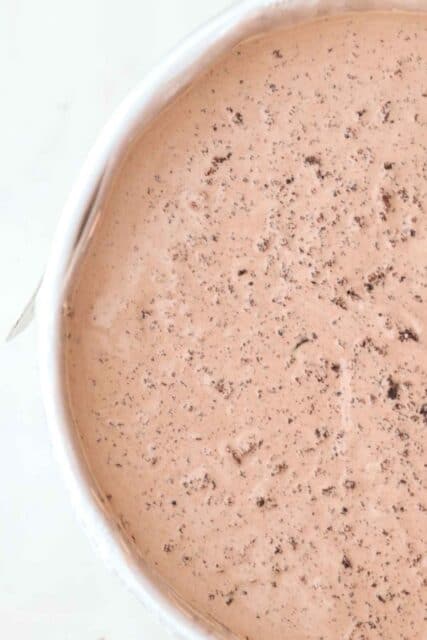 an overhead shot of a cake pan filled with chocolate ice cream
