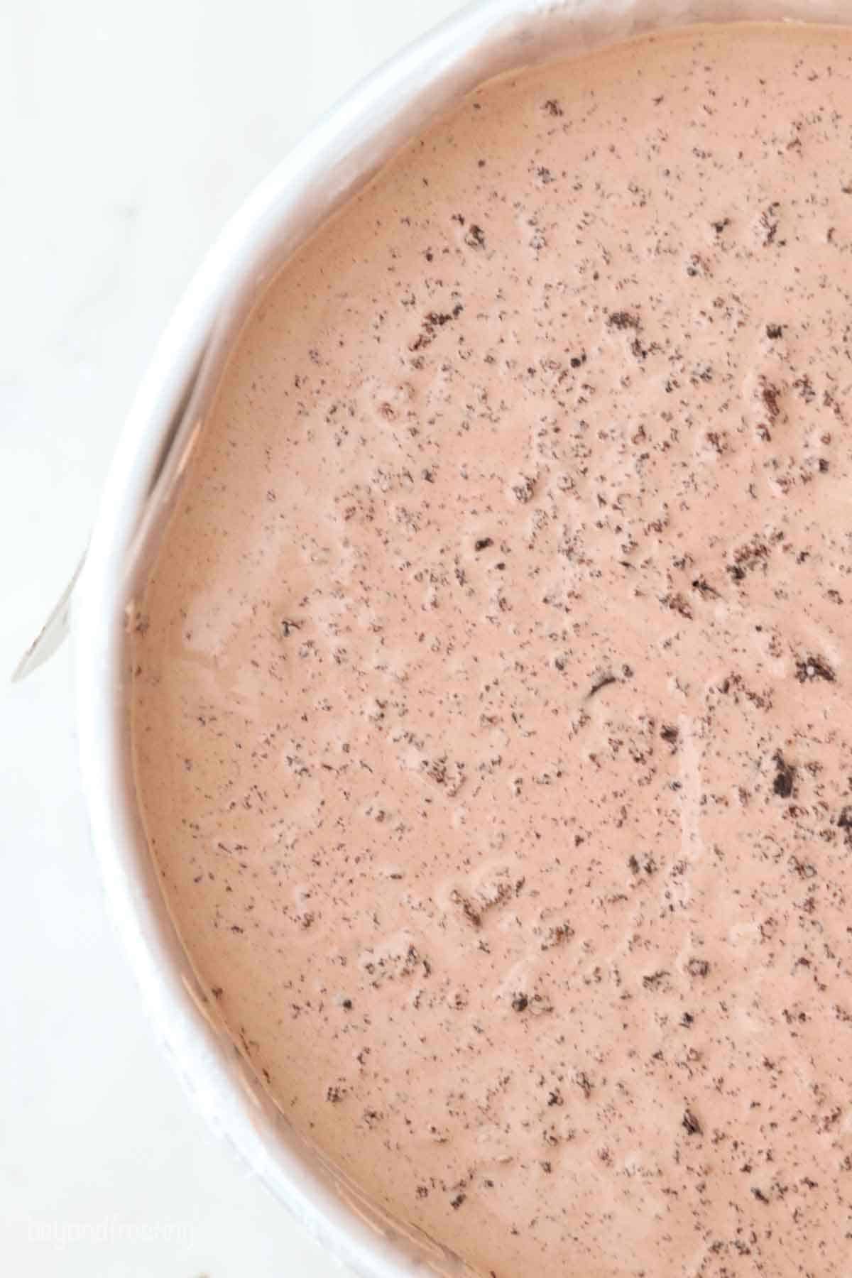an overhead shot of a cake pan filled with chocolate ice cream