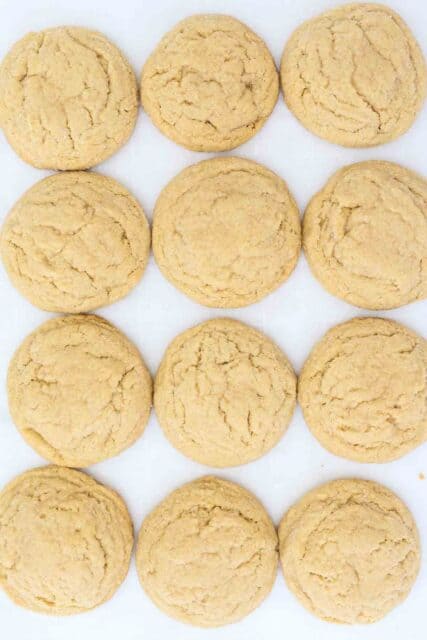 Peanut Butter Cookies on a baking sheet without the Hershey's Kisses in the center.