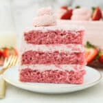 A slice of this three-layer Strawberry Cake with Strawberry Frosting.