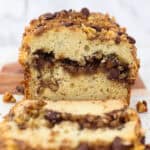 A loaf of sour cream coffee cake cut to show the inside