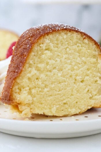 A piece of homemade pound cake sitting on a plate