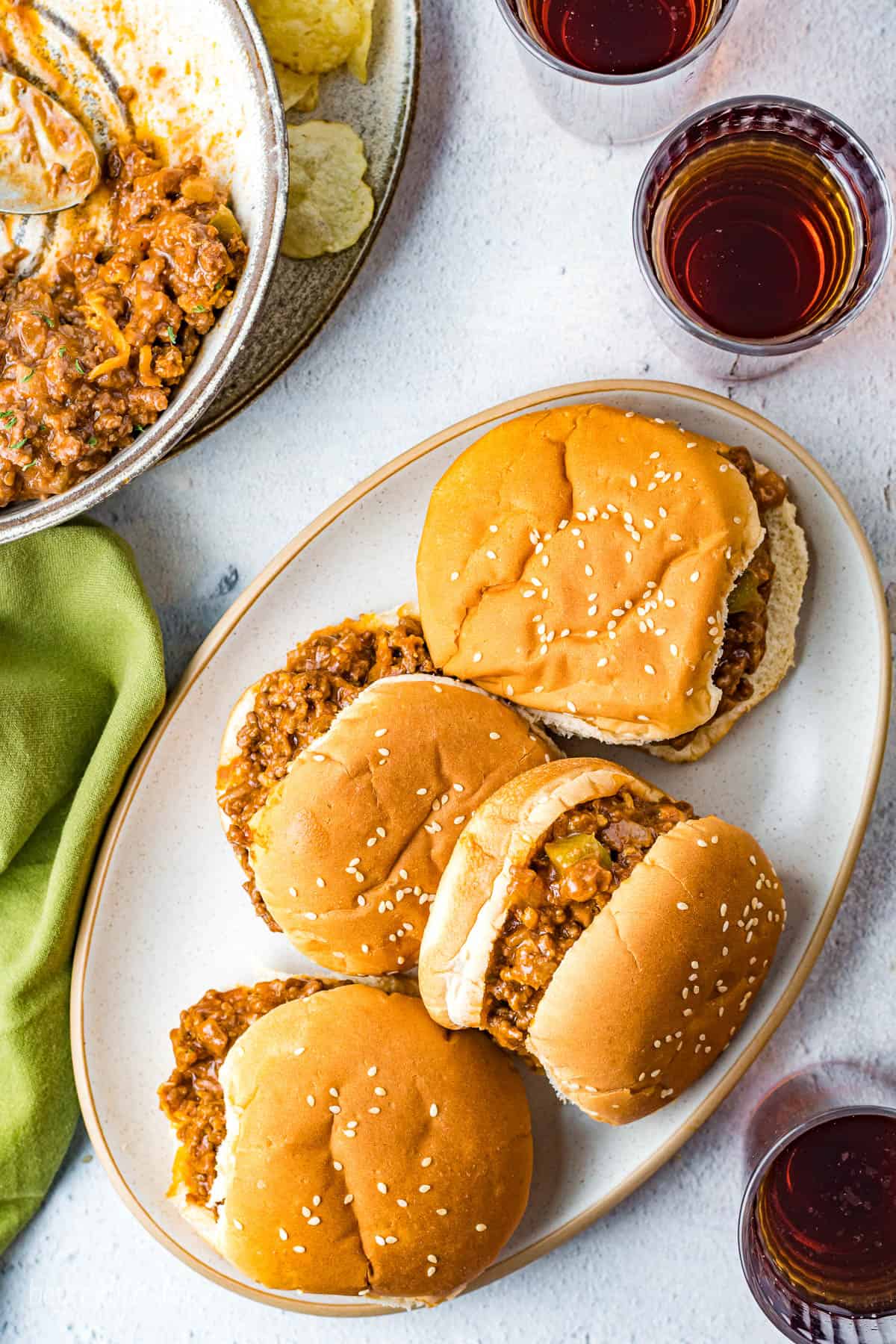 A platter of 4 finished Sloppy Joes.