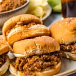 A side view of a platter of 4 finished Sloppy Joes.