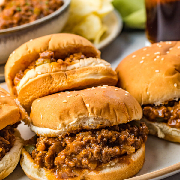 A side view of a platter of 4 finished Sloppy Joes.