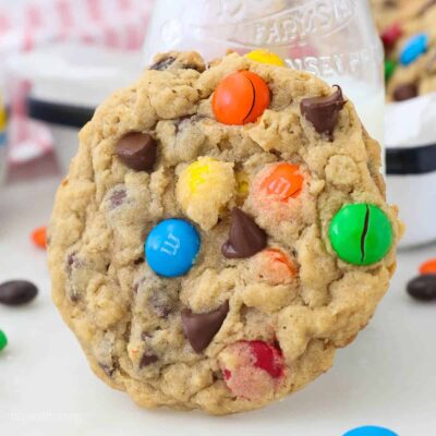 Close up of an Oatmeal Monster Cookie topped with M&Ms and Chocolate chips
