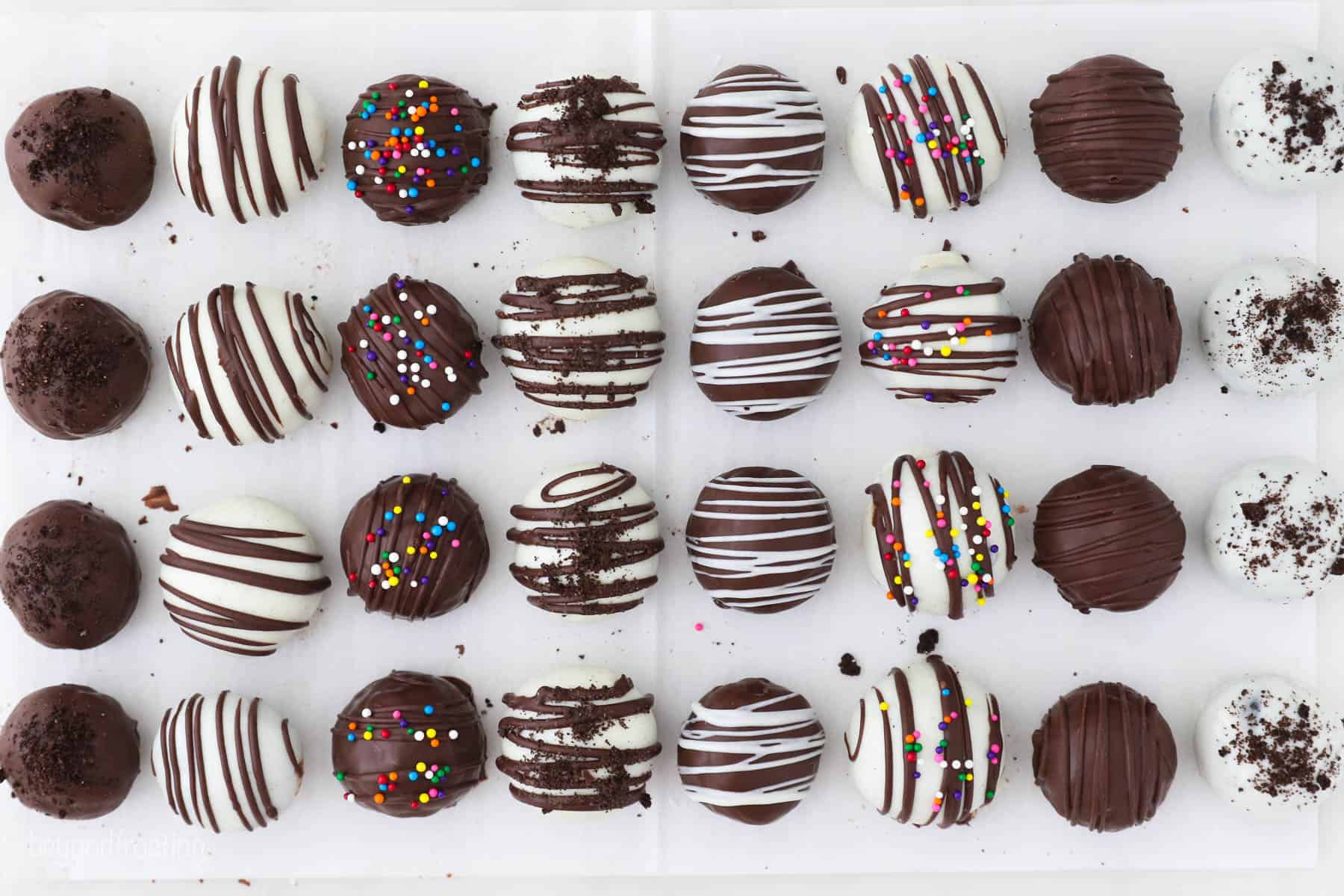 Oreo truffles come together fast, no baking required! With only 3 ingredients, these bite-sized Oreo balls make easy edible holiday gifts. Different ways to decorate Oreo balls using various chocolates and sprinkles.
