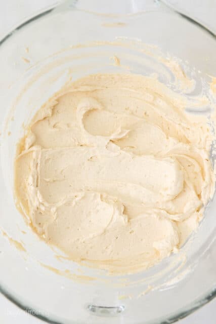 finished maple buttercream frosting in a mixing bowl