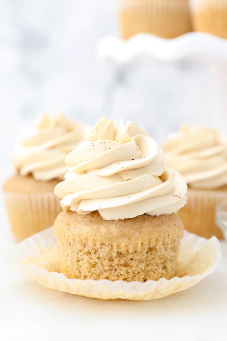 frosted apple pie cupcakes with the wrapper folded down
