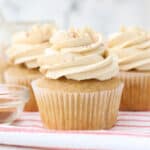 closeup of apple cupcakes topped with maple buttercream frosting