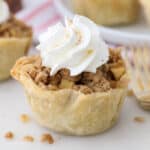 A small apple pie with whipped dream topping