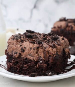 slice of Oreo dirt poke cake on a plate