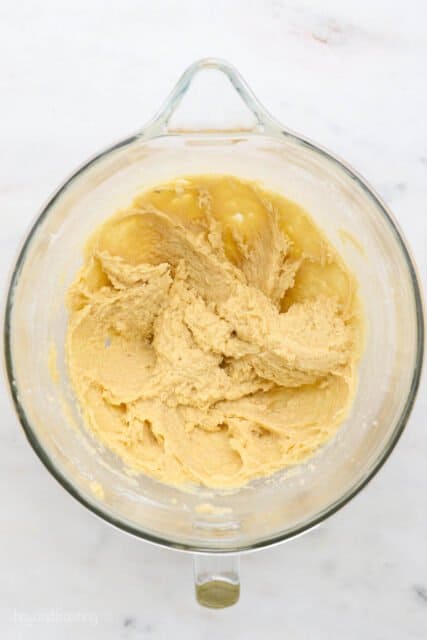 The combined wet ingredients in a glass container with the eggs and vanilla fully mixed in