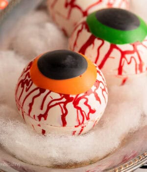 a close up of a halloween hot chocolate bomb decorated like an eyeball
