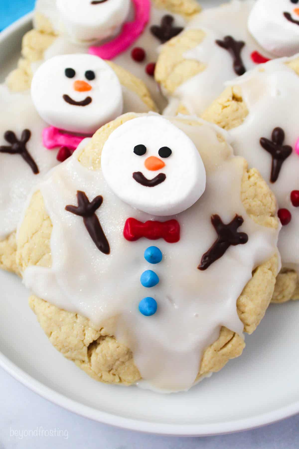 overhead closeup of holiday cookies on a white plate