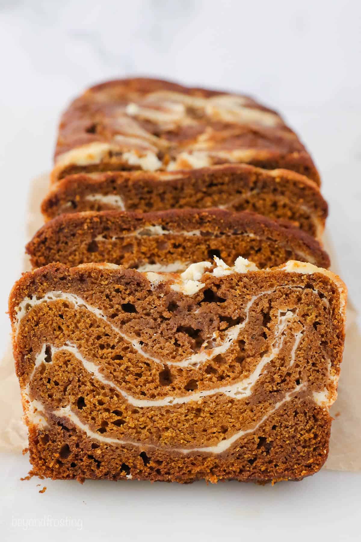 Slices of pumpkin bread stacked up against each other