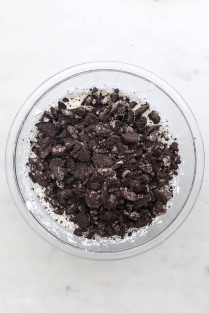 bowl of homemade whipped cream topped with crushed Oreos