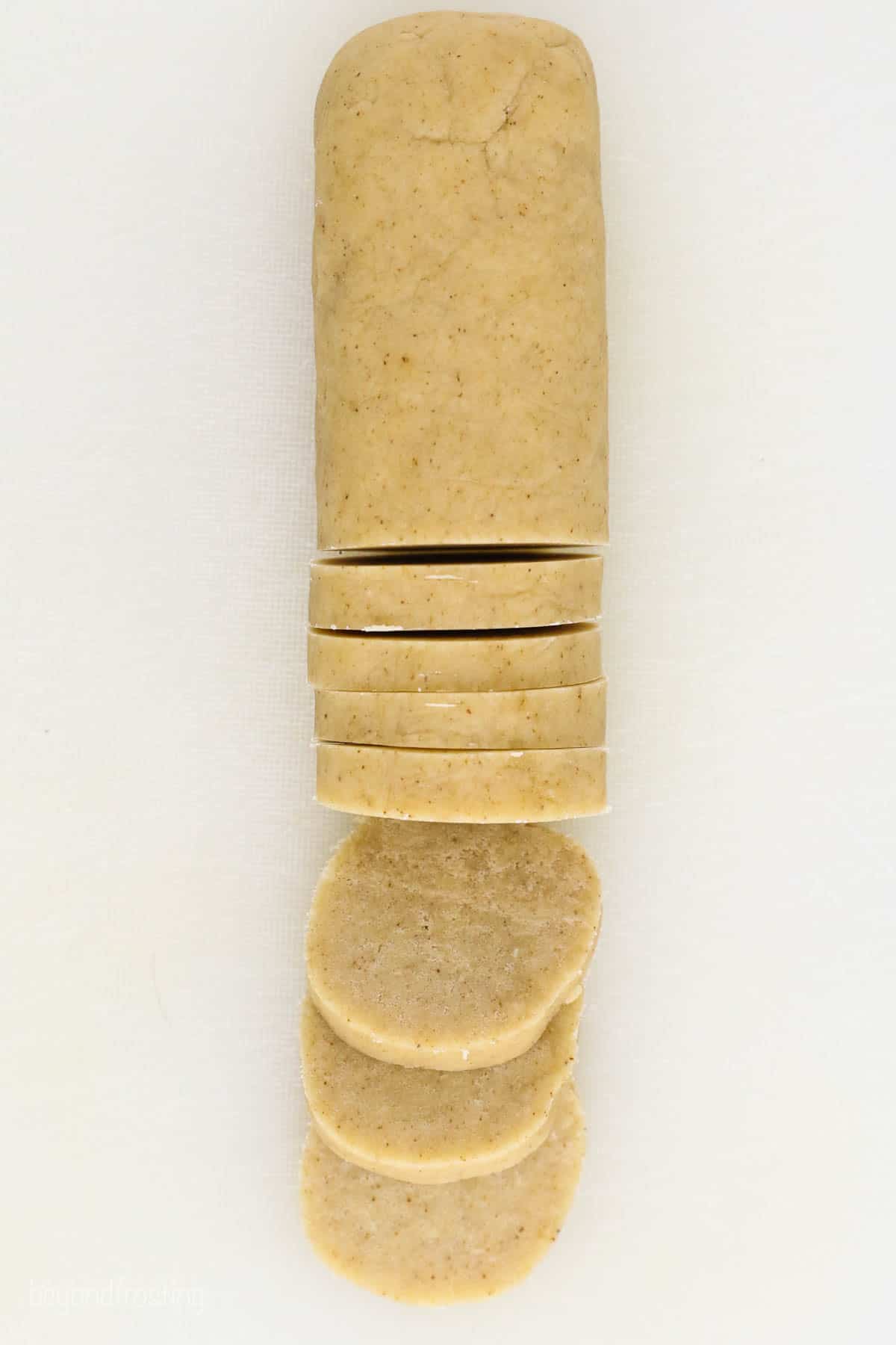 roll of shortbread cookie dough sliced