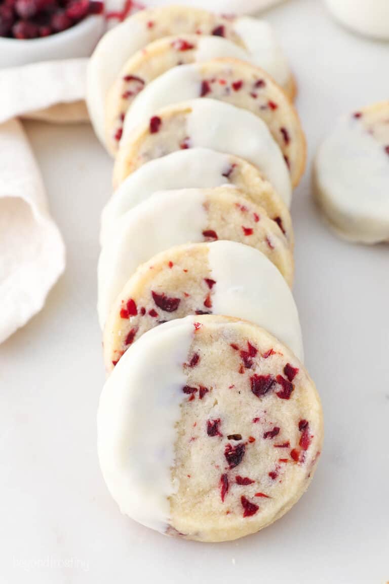 Cranberry shortbread cookies dipped in chocolate, lined up