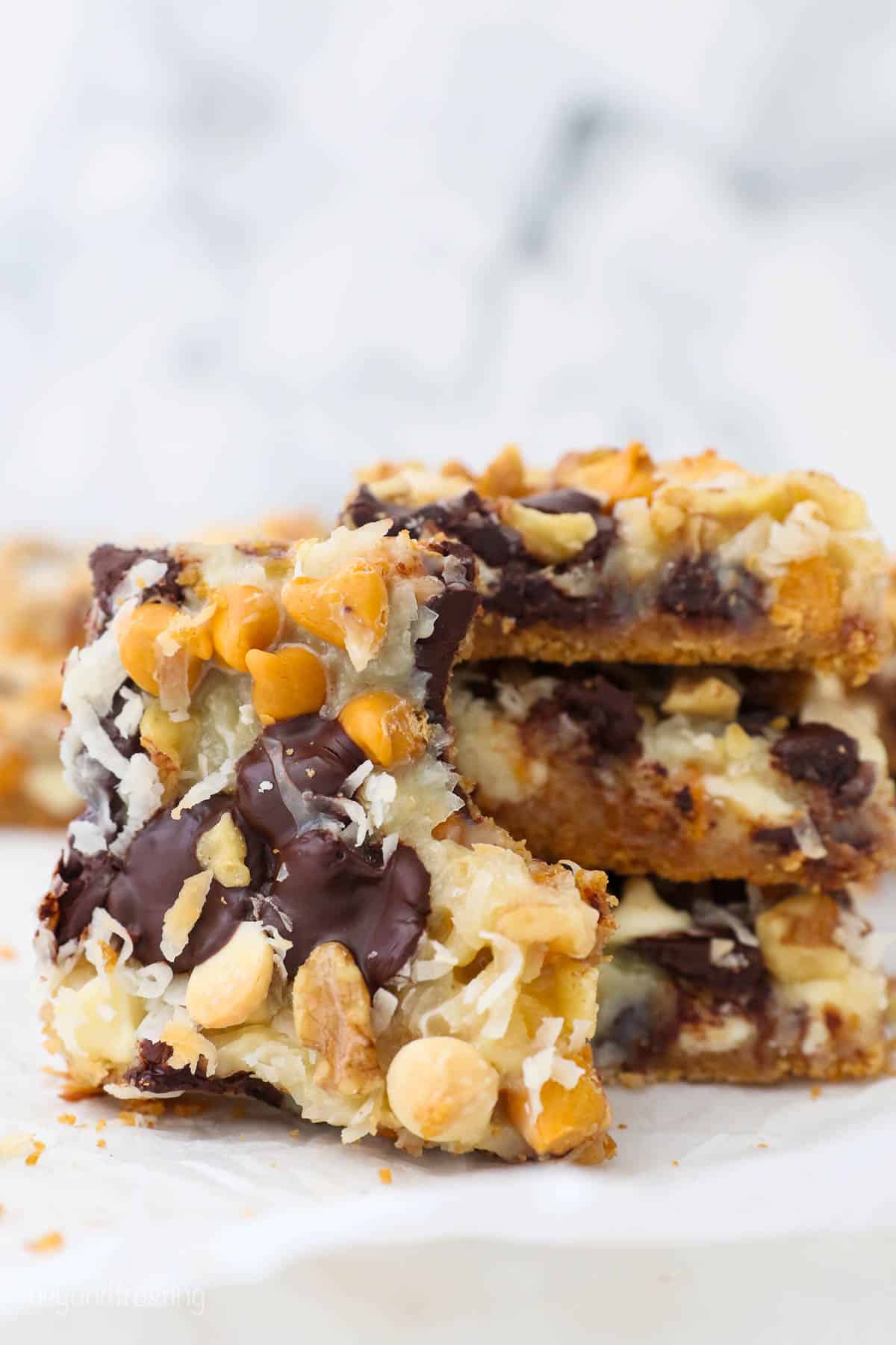 Three stacked seven layer bars with a fourth bar leaning up against the stack