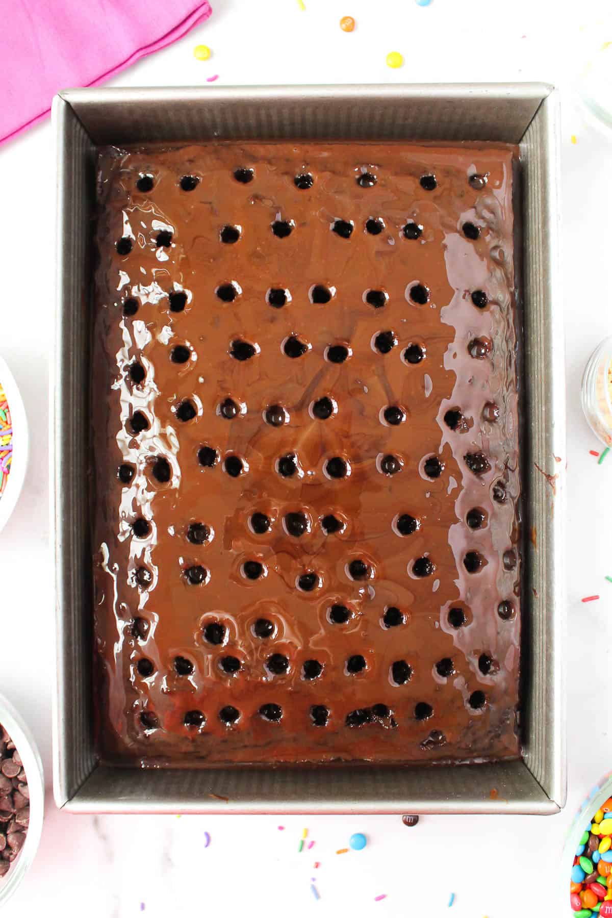 chocolate cake with holes poked in it from above