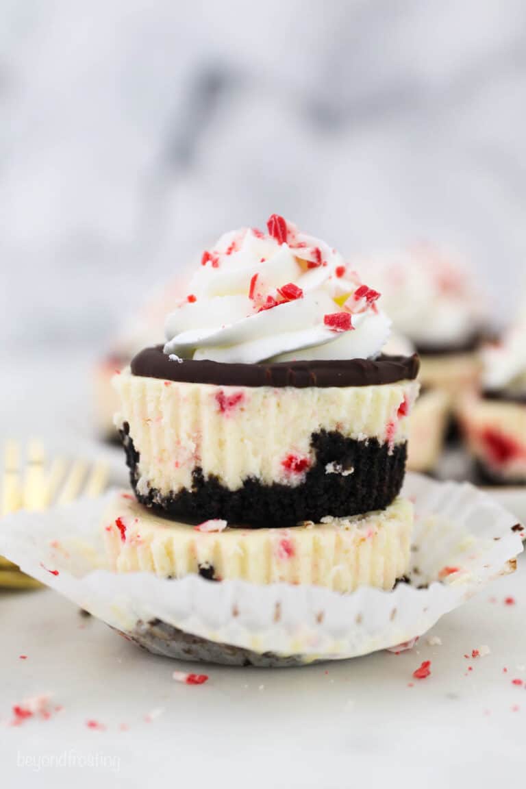 Two stacked peppermint bark cheesecakes unwrapped