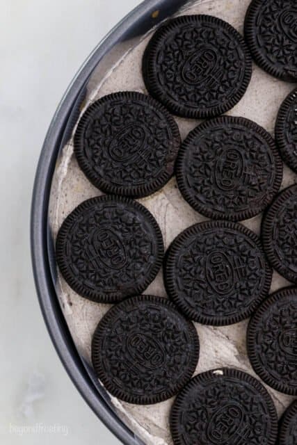 A view down into a pan showing Oreos laid out in a pattern