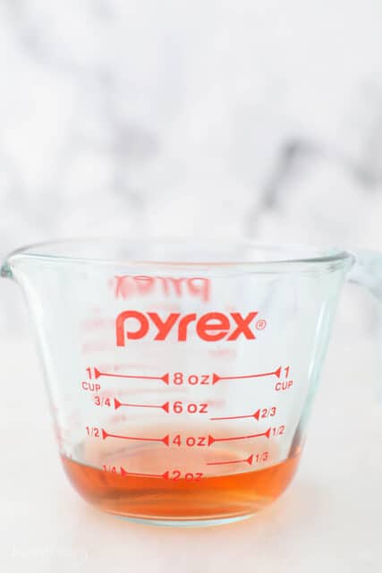 Pyrex glass measuring cup with reduced sparkling rosé