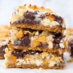 A stack of three 7-layer bars on a white countertop.