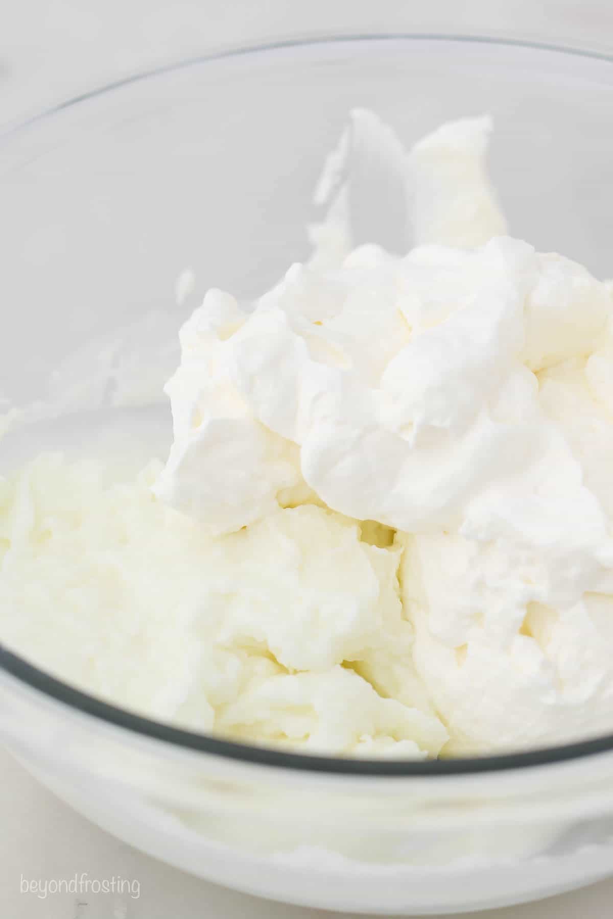 homemade whipped being mixed into pudding