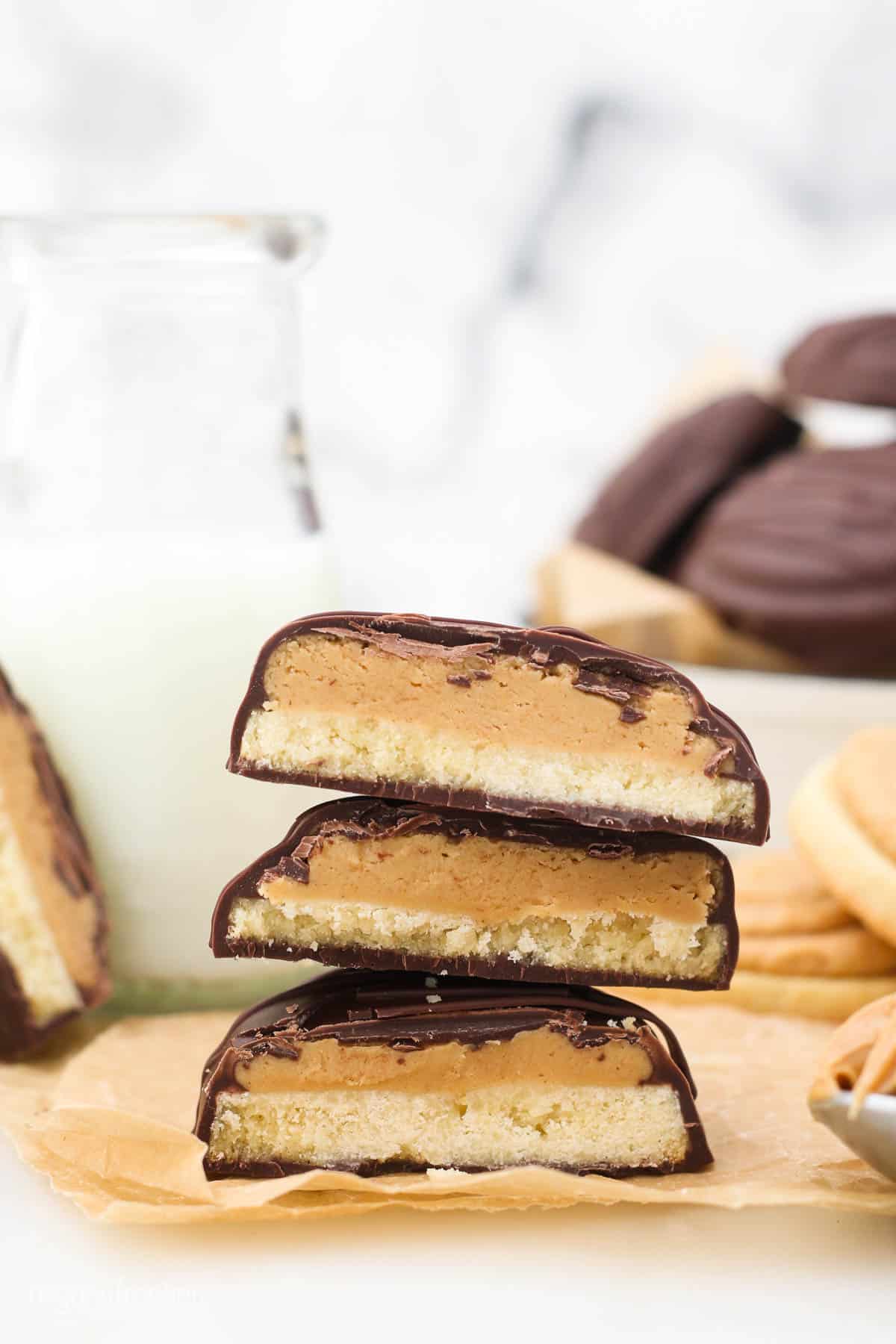 3 stacked Tagalong cookies cut in half to show the inside layers