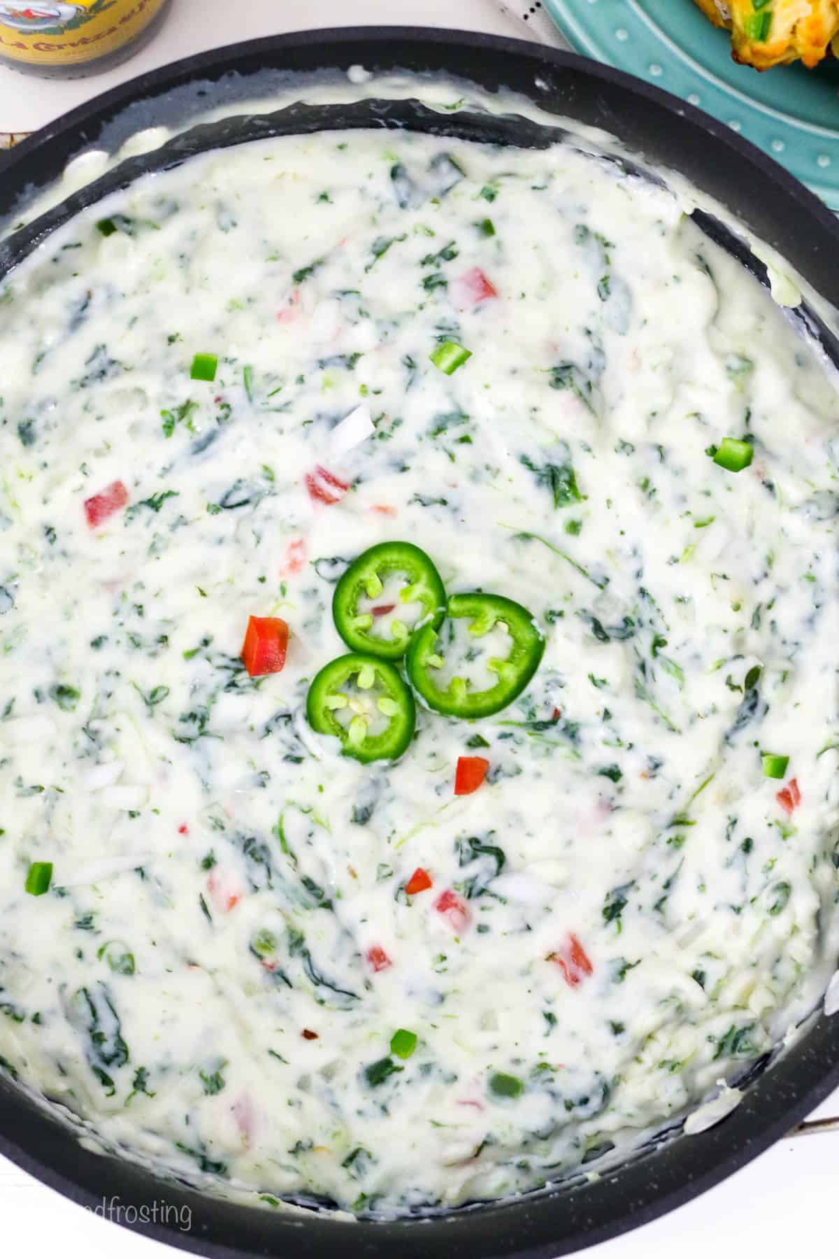 overheads of jalapeño spinach cheese dip in a pan