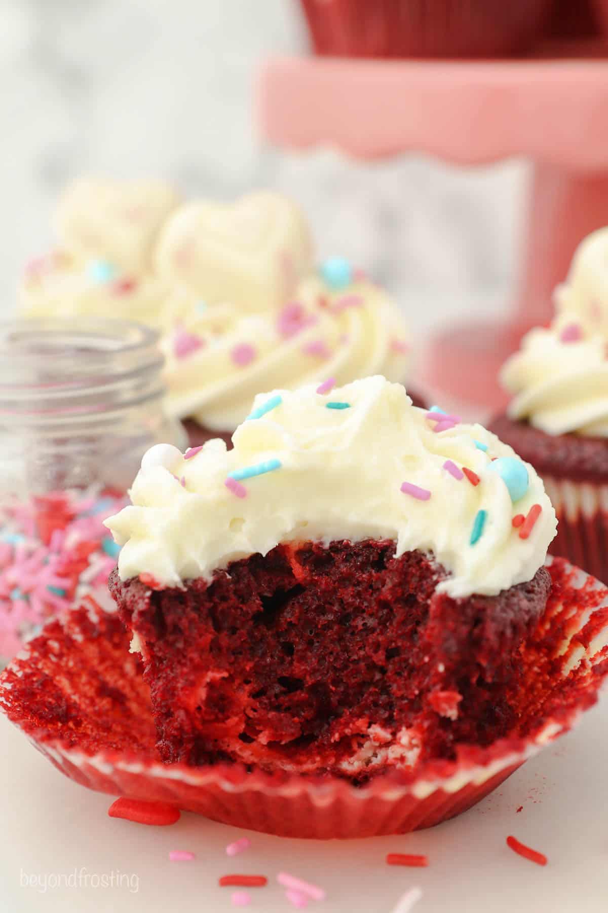 A Red velvet cupcake with a bite taken out of it