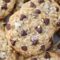 closeup of one oatmeal cookie piled on top of other oatmeal cookies