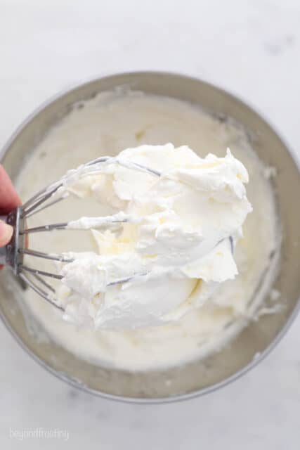 Mascarpone whipped cream on a whisk