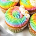 Overhead view of rainbow frosted cupcakes