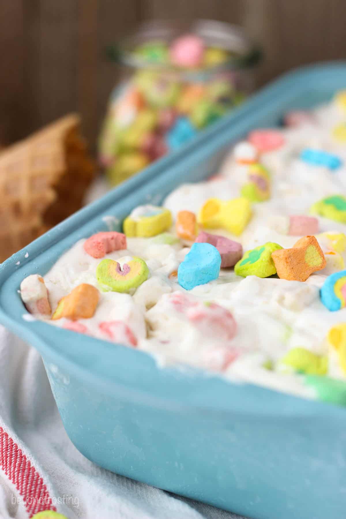A blue dish with Lucky Charms topped ice cream
