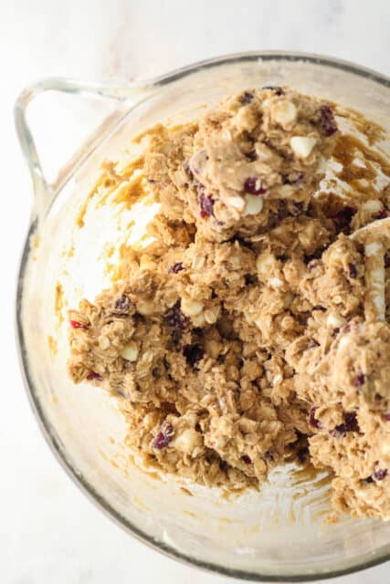 Oatmeal cranberry cookie dough in a mixing bowl