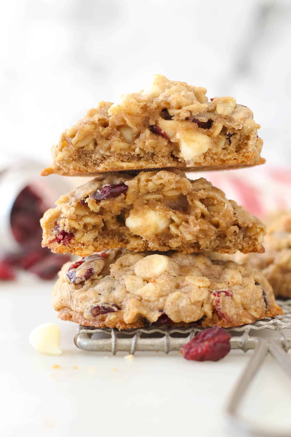 Two halves of oatmeal cranberry cookies stacked on each other
