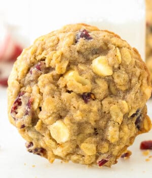 A white chocolate cranberry oatmeal cookie on its side