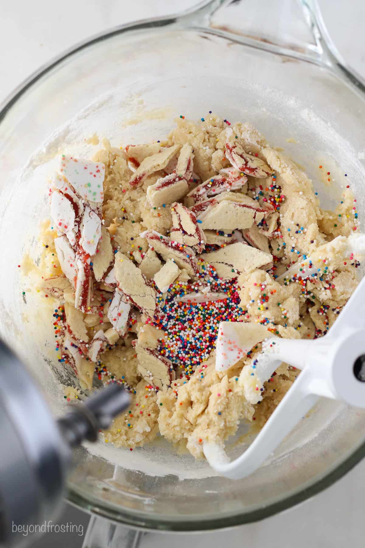 pieces of pop tart being added to sugar cookie dough