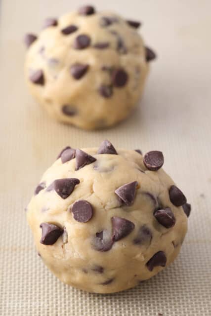 Two giant balls of chocolate chip cookie dough