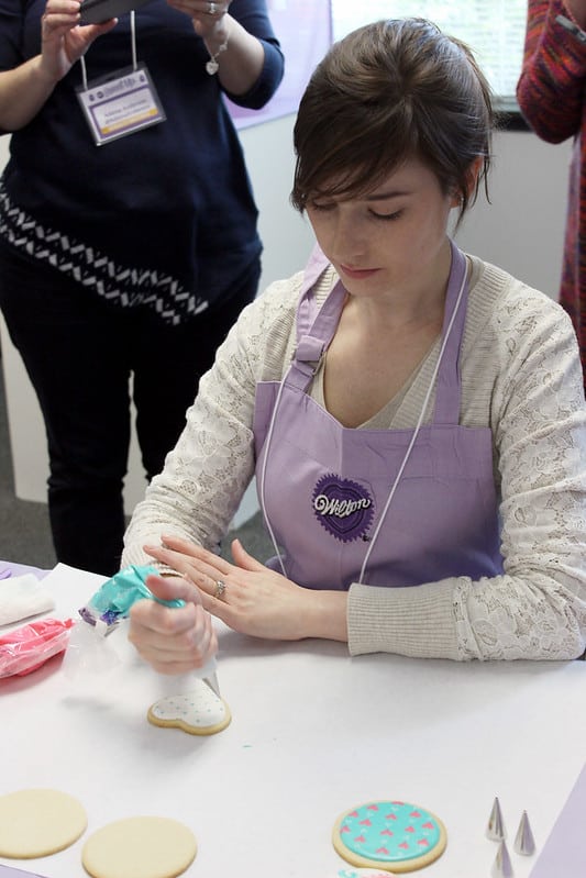 Cookie artist decorating sugar cookies