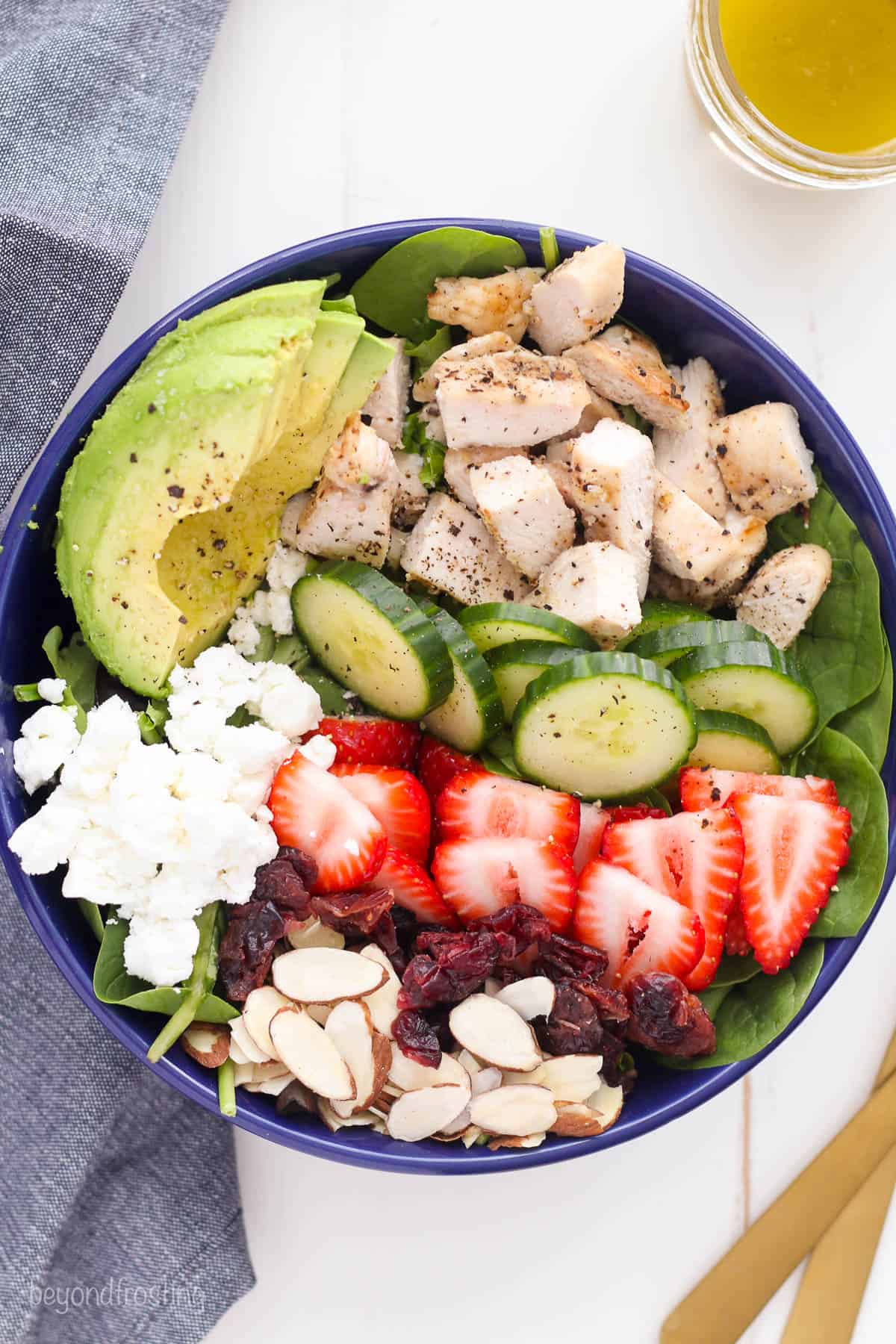 overhead of a bowl of chicken strawberry salad