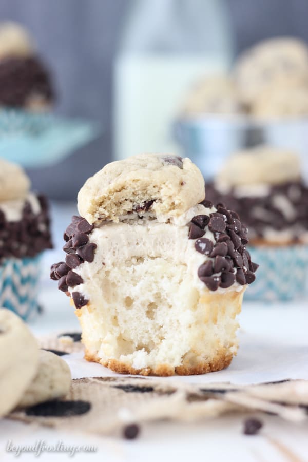 side view of a cookie dough cupcake with a bite taken out