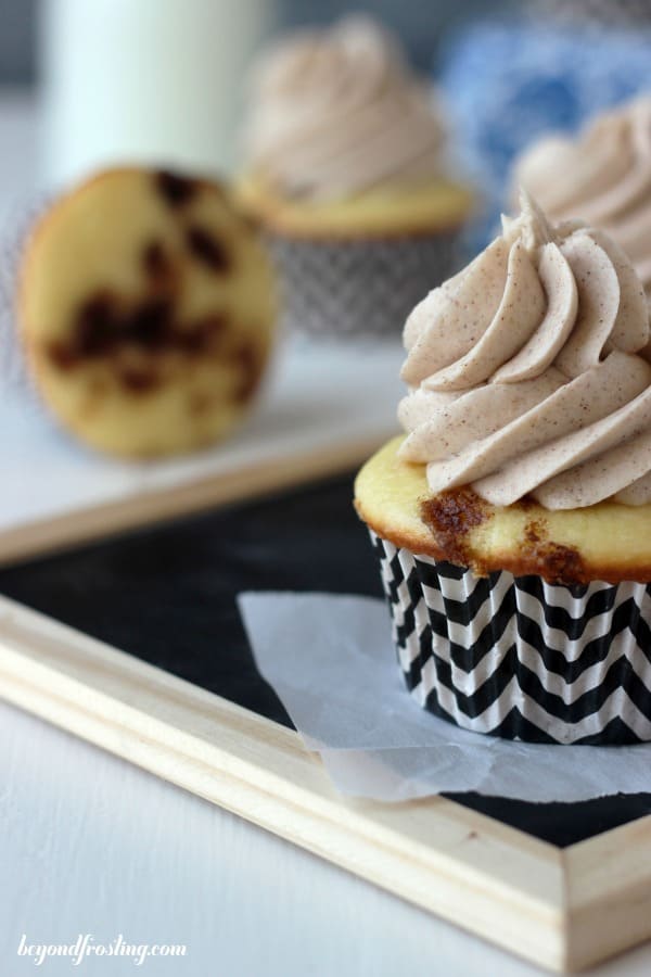 side view of a frosted cinnamon roll cupcake