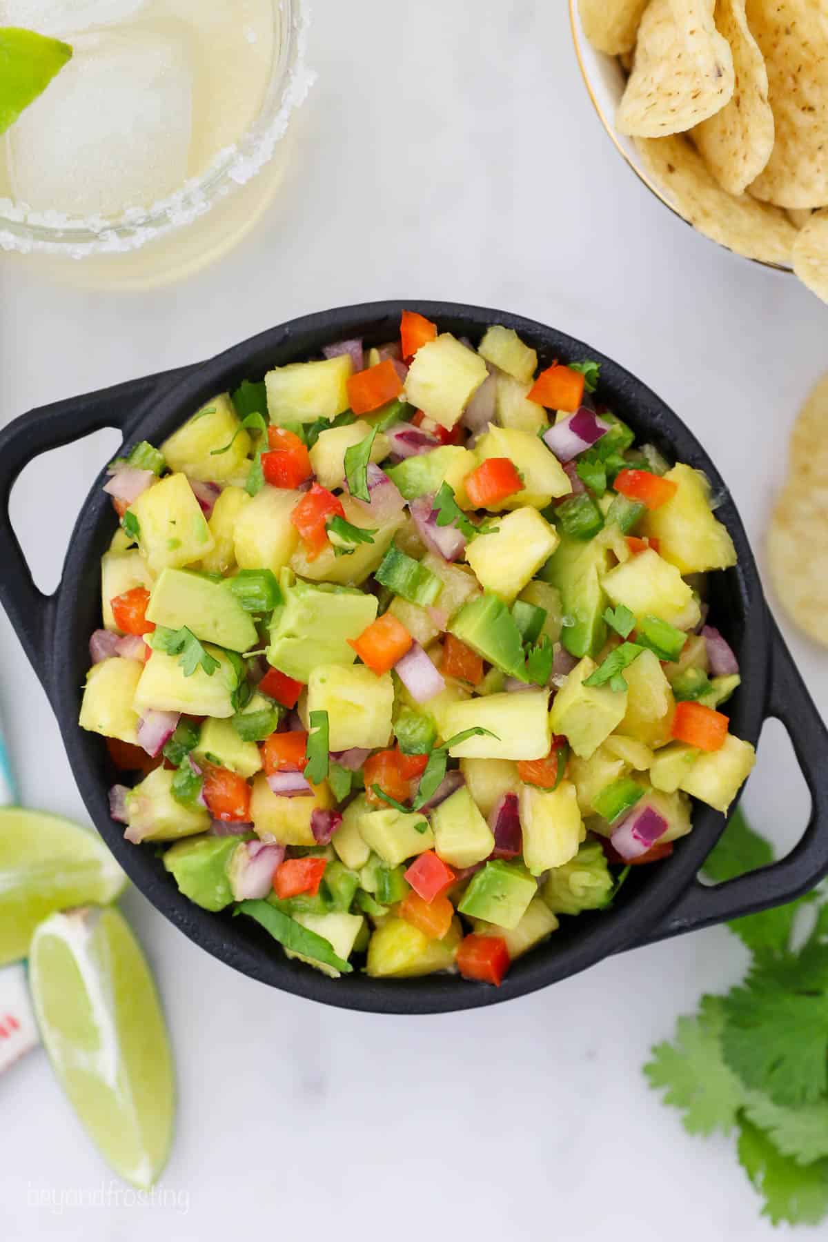 overhead of a bowl of pineapple avocado salsa