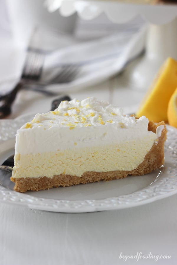 side view of a slice of lemon pie on a plate