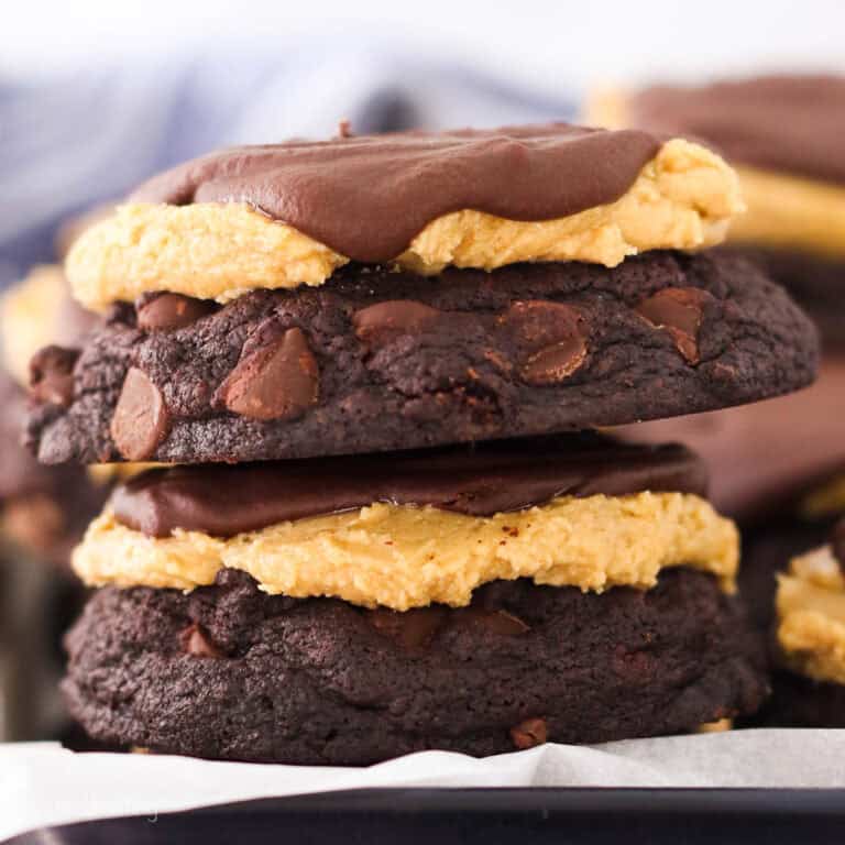 Two peanut butter buckeye cookies stacked on each other